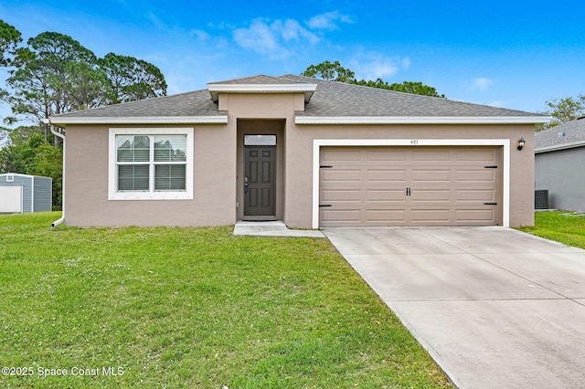 view of front of home with a front yard, driveway, and stucco siding