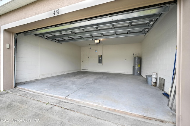 garage featuring electric panel, a garage door opener, and water heater