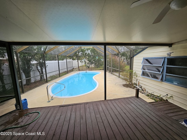 view of swimming pool with a lanai, a fenced backyard, a fenced in pool, and a patio