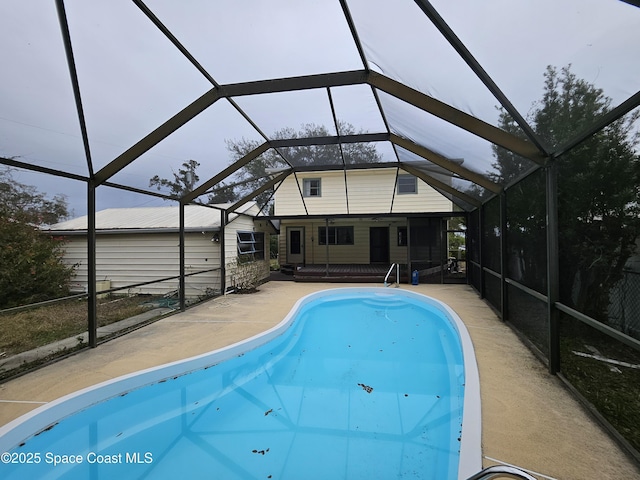 pool with a patio and a lanai