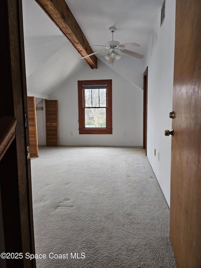 bonus room featuring vaulted ceiling with beams, ceiling fan, visible vents, and carpet flooring