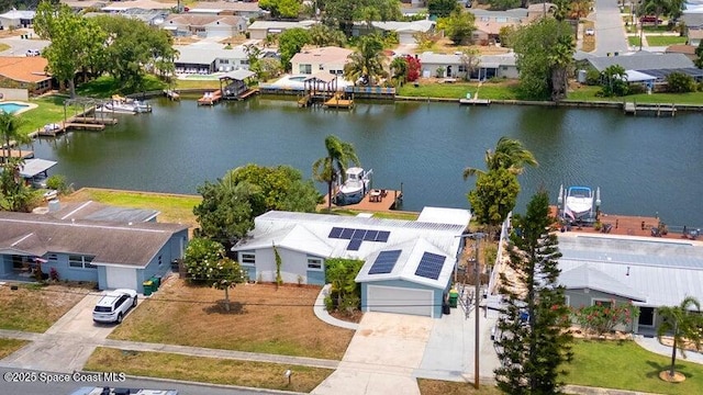 aerial view with a residential view and a water view