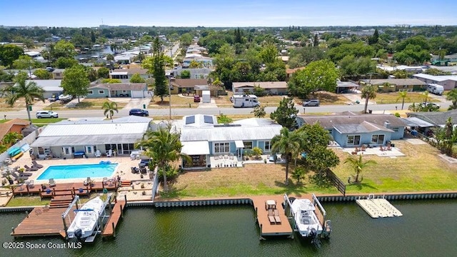 drone / aerial view featuring a residential view and a water view