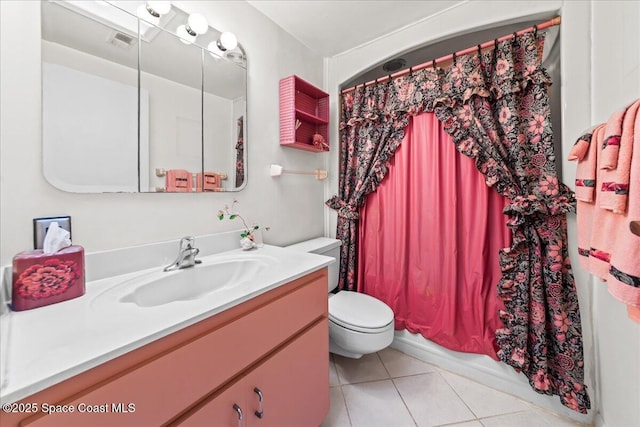 bathroom with vanity, visible vents, tile patterned flooring, curtained shower, and toilet