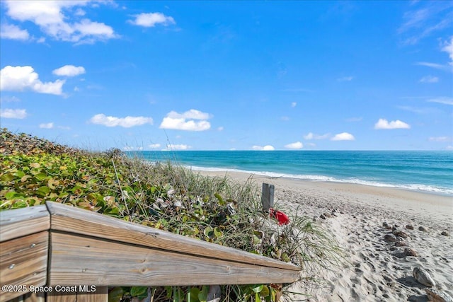 property view of water featuring a beach view