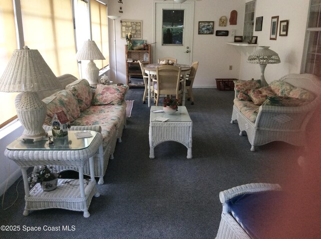 165 Heron Dr, Melbourne Beach, FL 32951 - carpeted living room featuring baseboards