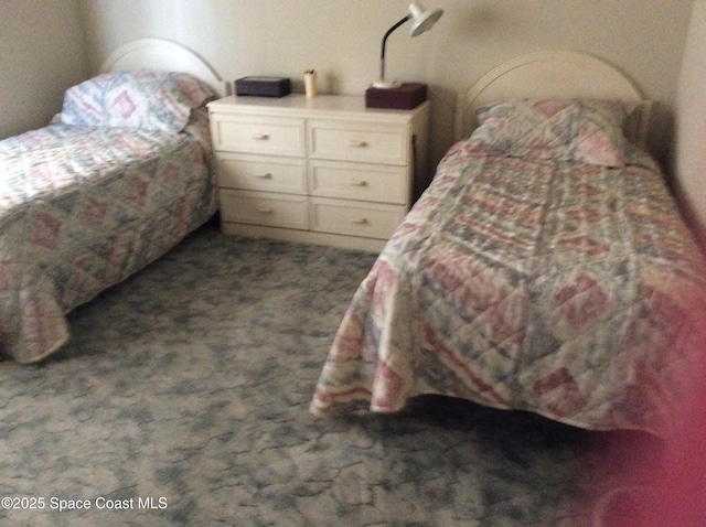165 Heron Dr, Melbourne Beach, FL 32951 - bedroom featuring dark carpet