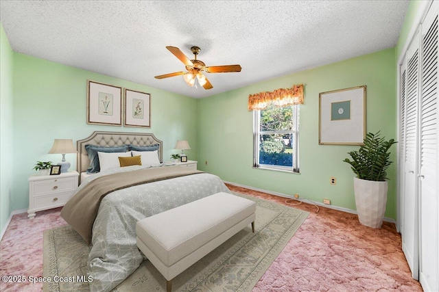 165 Heron Dr, Melbourne Beach, FL 32951 - bedroom with a textured ceiling, a closet, ceiling fan, light colored carpet, and baseboards