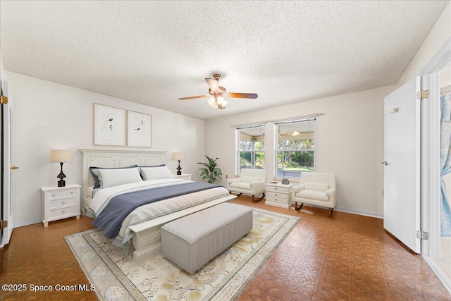 165 Heron Dr, Melbourne Beach, FL 32951 - bedroom with a ceiling fan, baseboards, and a textured ceiling