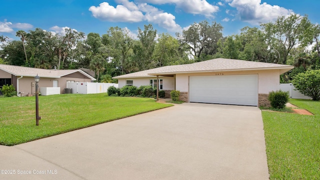 ranch-style house featuring fence, driveway, a front lawn, a garage, and brick siding