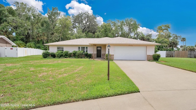 single story home with a front lawn, fence, stucco siding, driveway, and an attached garage