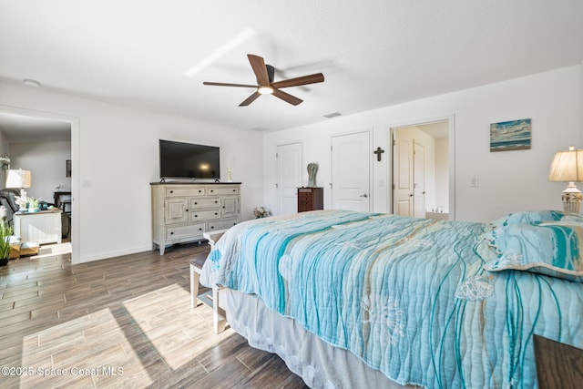 bedroom with baseboards, a ceiling fan, visible vents, and wood tiled floor