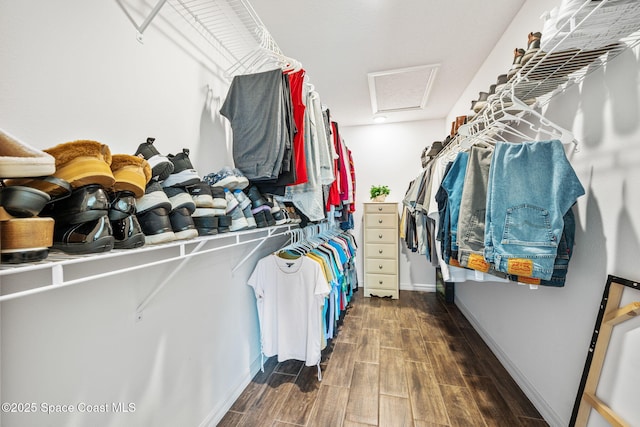 spacious closet with attic access and wood tiled floor