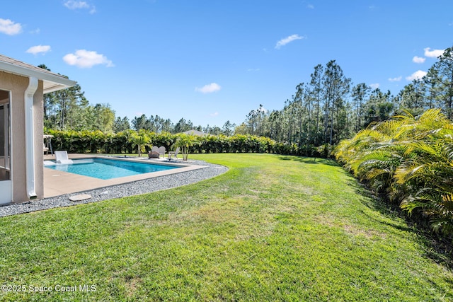 view of yard with an outdoor pool