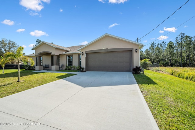 ranch-style home featuring stucco siding, concrete driveway, a front yard, and a garage