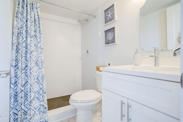 full bathroom with vanity, a shower with shower curtain, and toilet