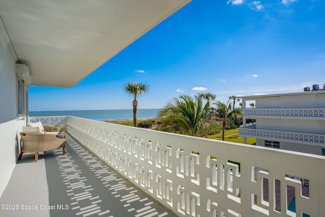 balcony featuring a water view