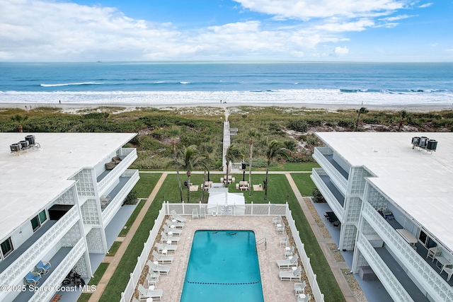 bird's eye view featuring a view of the beach and a water view