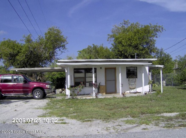 exterior space featuring a carport