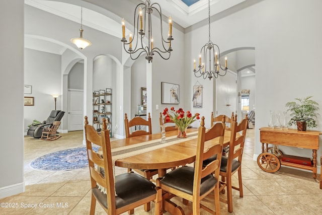 dining space with light tile patterned floors, arched walkways, a chandelier, and crown molding