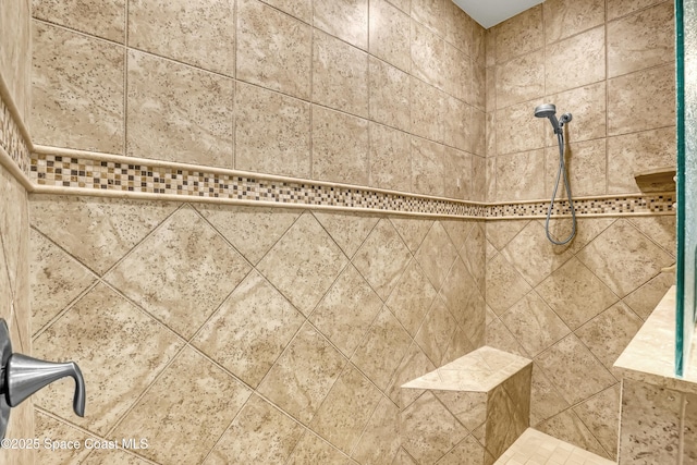 room details featuring a tile shower