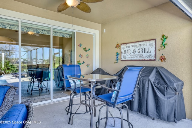 view of patio / terrace featuring a lanai and ceiling fan