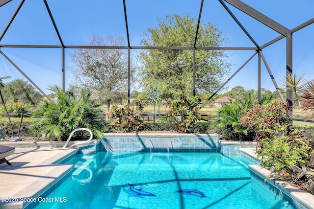 outdoor pool with a lanai and a patio area