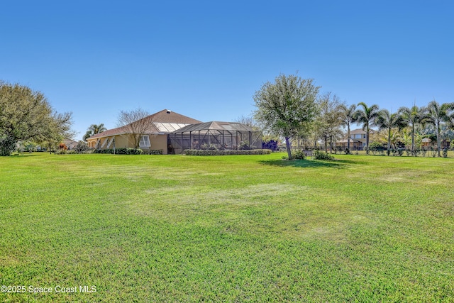 view of yard with a lanai