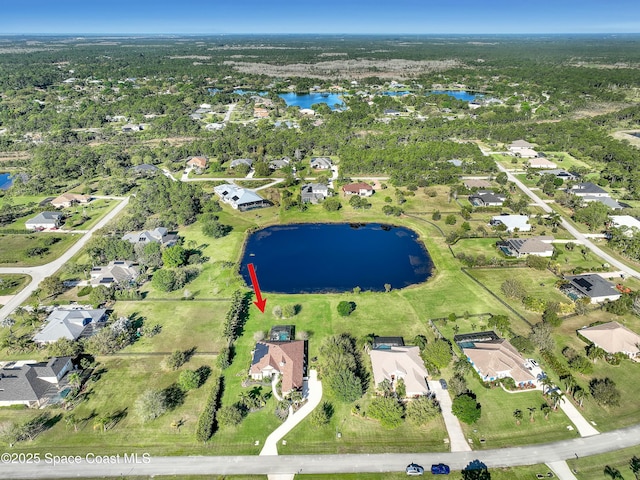 aerial view with a residential view and a water view