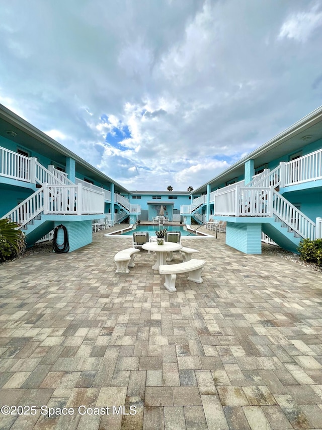 exterior space featuring a patio area and stairway