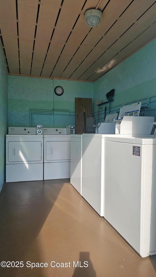 community laundry room with washer and clothes dryer