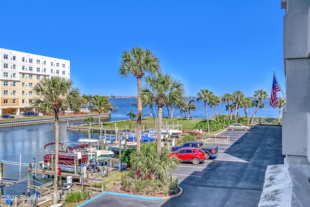 exterior space with a boat dock and a water view