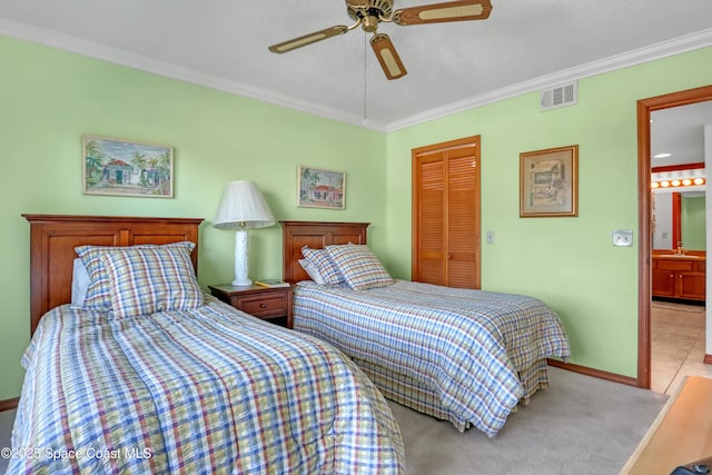 bedroom with visible vents, ornamental molding, a closet, baseboards, and ceiling fan