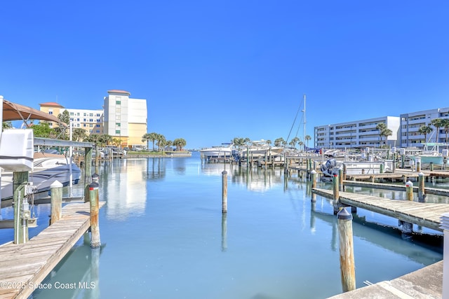 dock area with a water view and boat lift