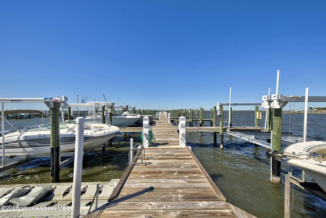 view of dock featuring a water view and boat lift