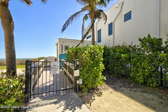 view of gate with fence