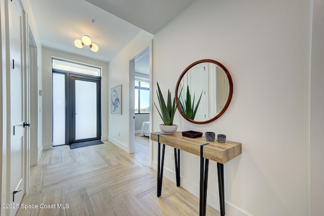 entryway featuring baseboards