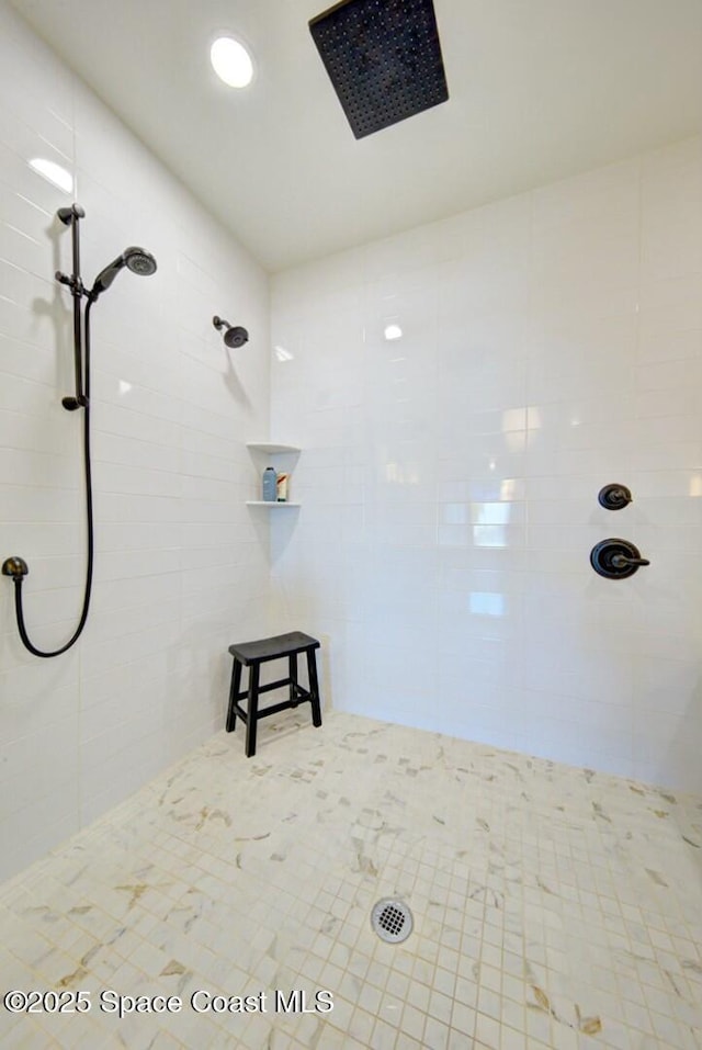 full bathroom with tiled shower