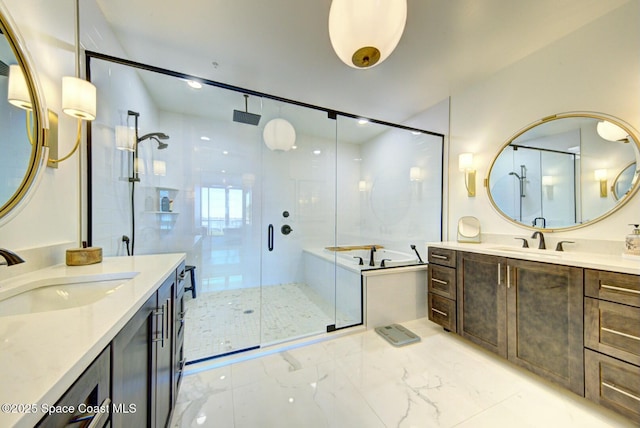 bathroom with a stall shower, two vanities, and a sink