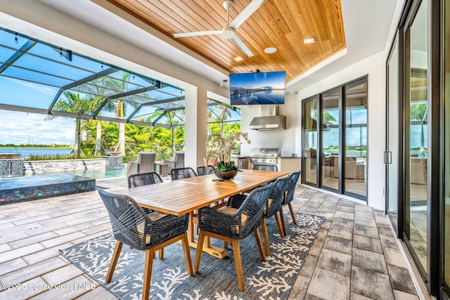 sunroom with wooden ceiling and a water view