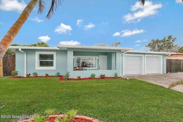 ranch-style house featuring fence, a front yard, stucco siding, driveway, and an attached garage