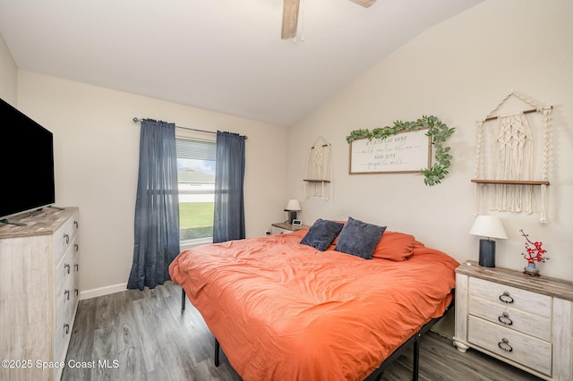 bedroom featuring ceiling fan, baseboards, lofted ceiling, and wood finished floors