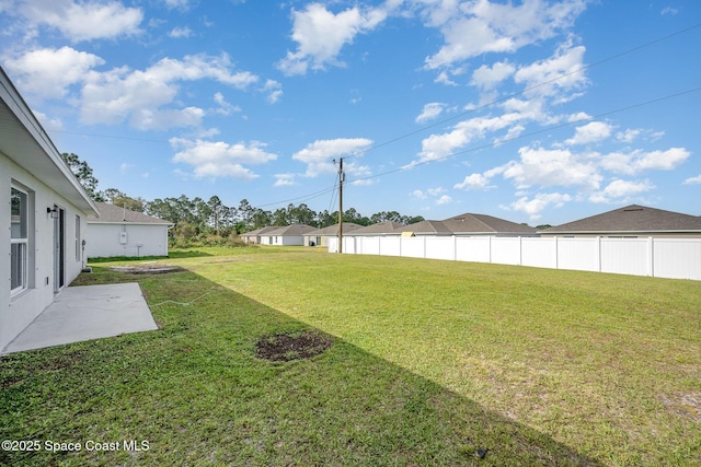 view of yard featuring a patio area and fence