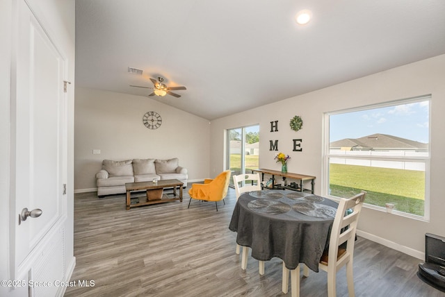 rec room featuring visible vents, baseboards, lofted ceiling, and wood finished floors