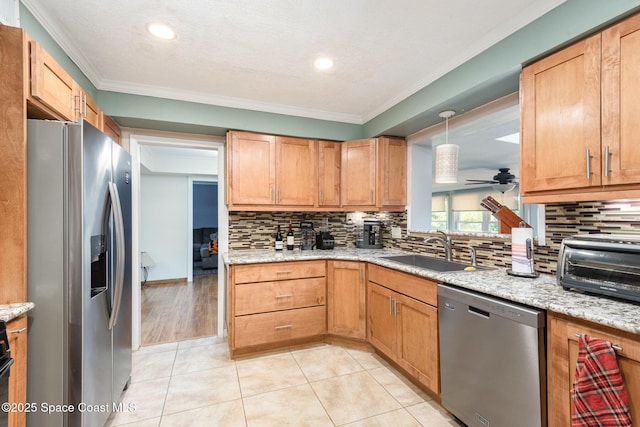 3530 Alan Dr, Titusville, FL 32780 - kitchen with a sink, stainless steel appliances, backsplash, and a ceiling fan