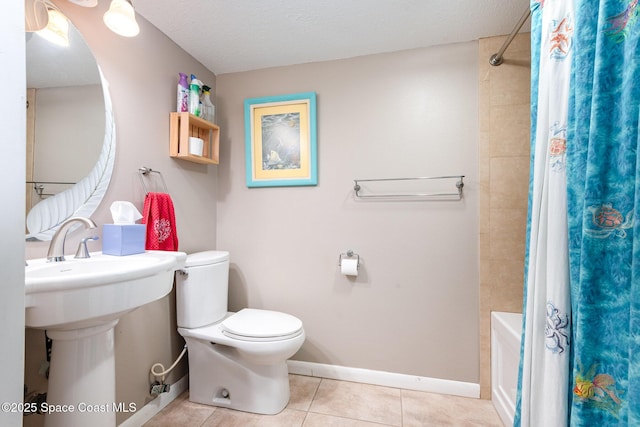 3530 Alan Dr, Titusville, FL 32780 - bathroom with baseboards, toilet, shower / tub combo, tile patterned floors, and a textured ceiling
