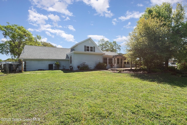 3530 Alan Dr, Titusville, FL 32780 - exterior space featuring cooling unit, fence, a yard, and a shingled roof