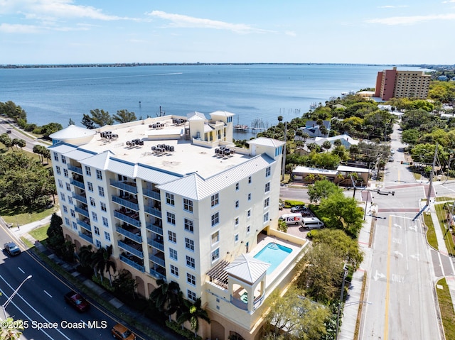 birds eye view of property featuring a water view