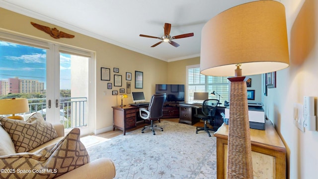 office space with crown molding, french doors, baseboards, and ceiling fan