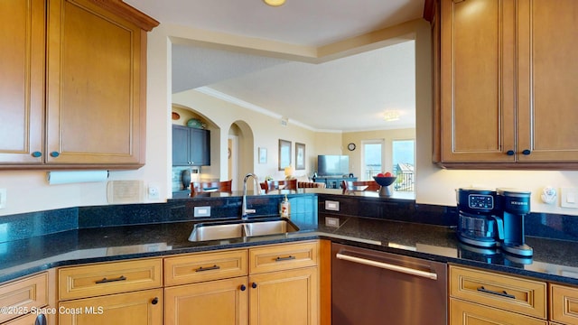 kitchen with ornamental molding, a sink, dark stone countertops, stainless steel dishwasher, and arched walkways